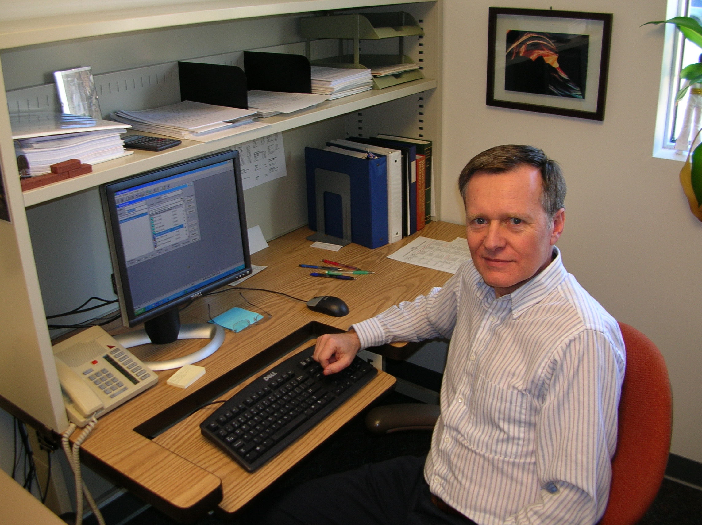 Glen working at his desk.